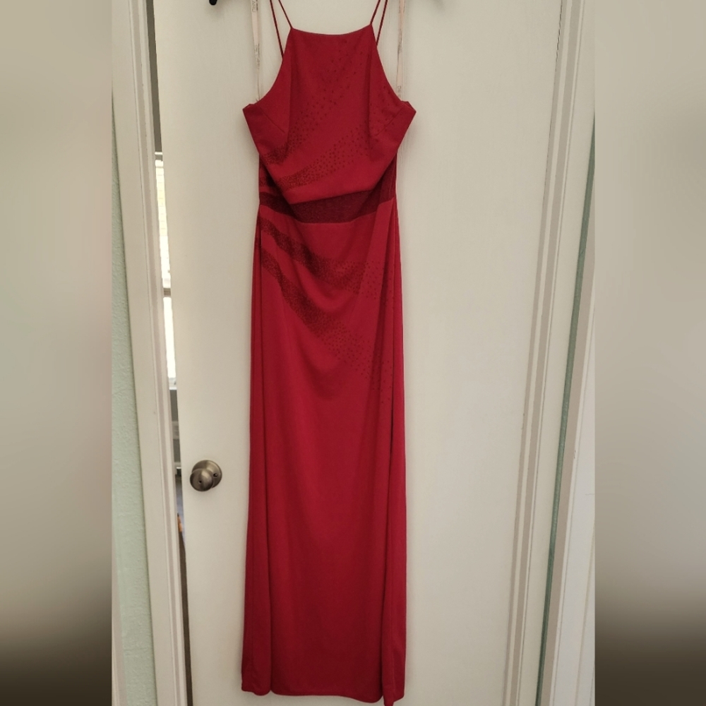 Women's formal dress with beading sheer waist cutout and lace up back.